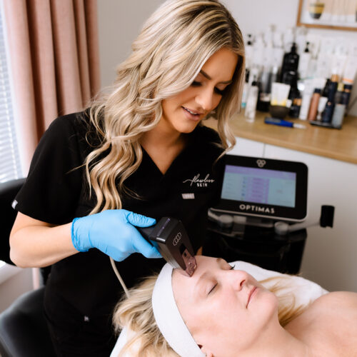 Owner and Master Esthetician, Alexis Hoggard, performing advance skincare of Morpheus8 service on a client