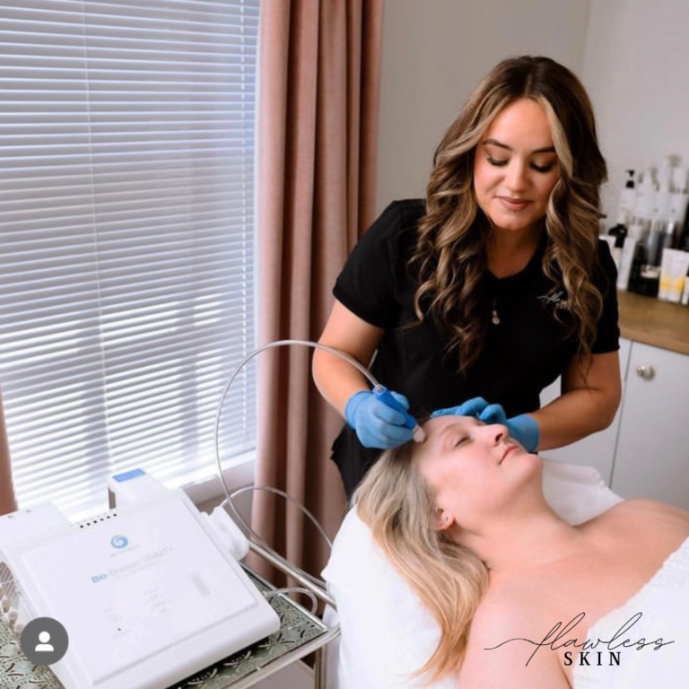 Estheticians preforming a Trinity Hydrodermabrasion Facial on a client