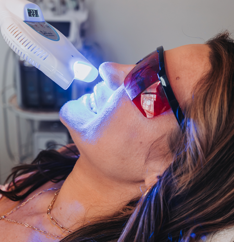 Woman receiving a teeth whitening procedure