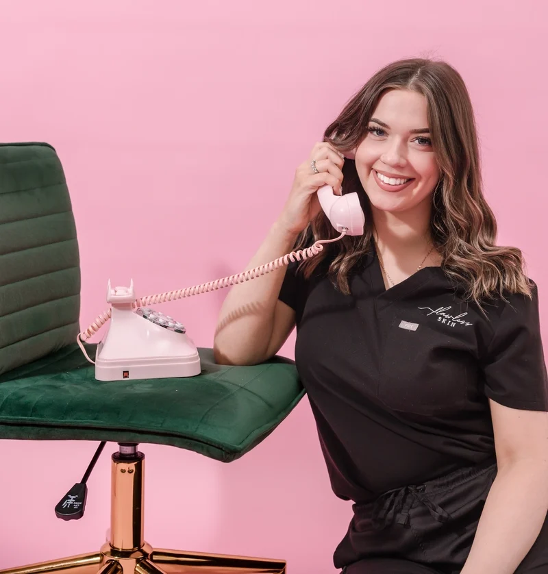Office Manager at Flawless Skin answering a call.