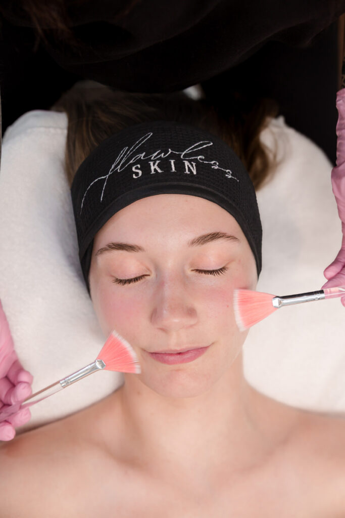 Woman receiving a facial at Flawless Skin Virginia Beach